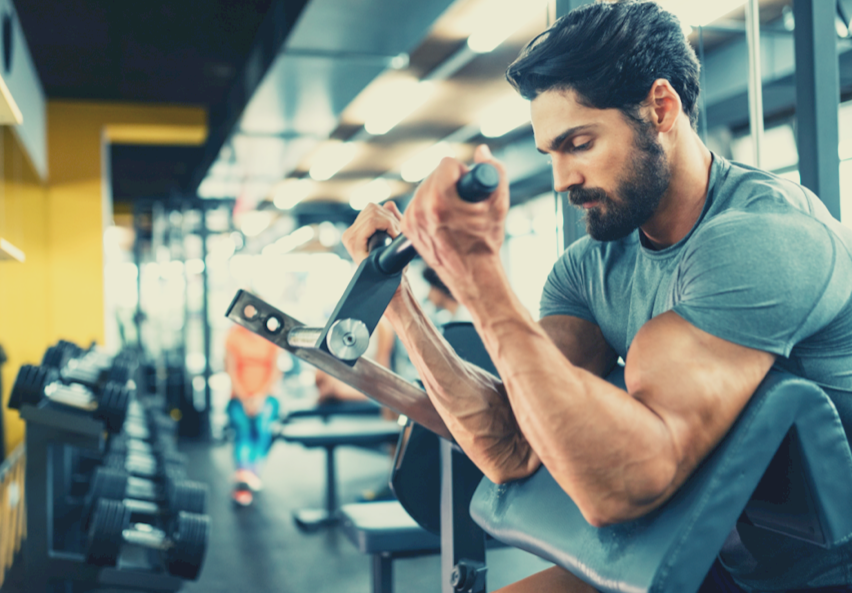 athletic man doing bicep curl