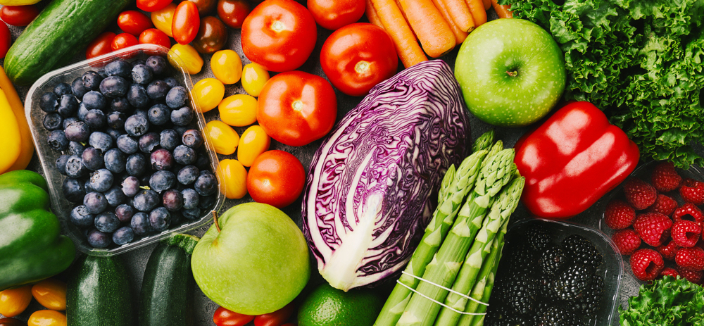 Different tasty vegetables on rough background