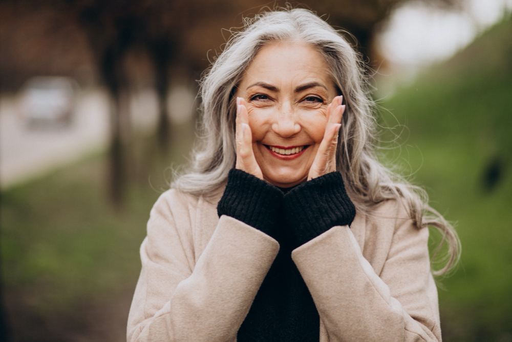 photo elderly happy woman walking in park