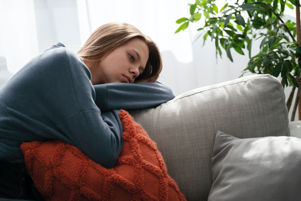 photo sad young woman at home looking depressed