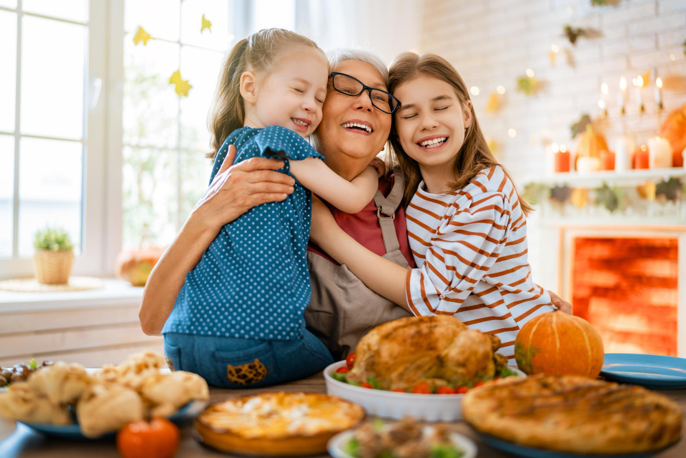 grandmother holding her grand children on thanksgiving 