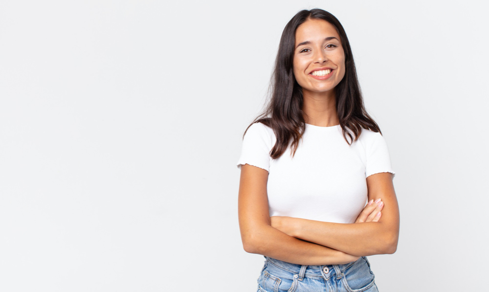 pretty thin hispanic woman looking like a happy, proud and satisfied