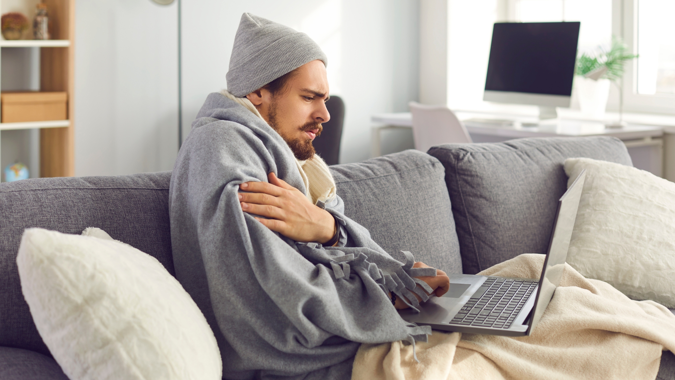 A man checking his symptoms online to self diagnose