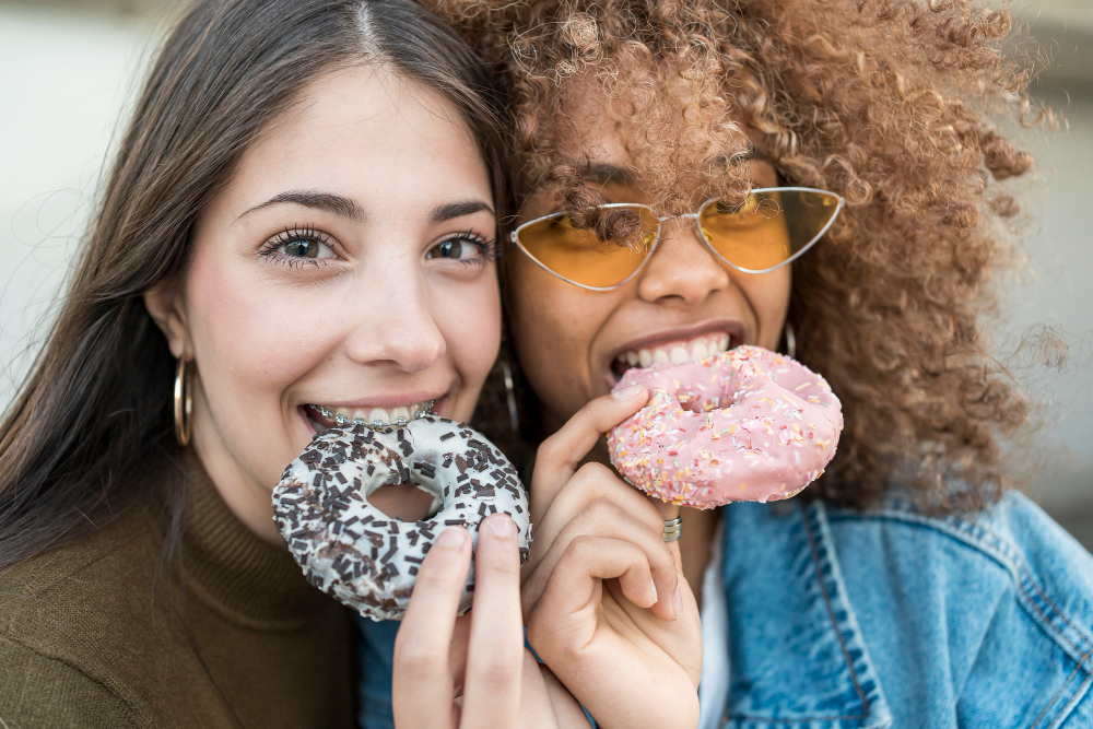 Close-up girls with doughnuts
