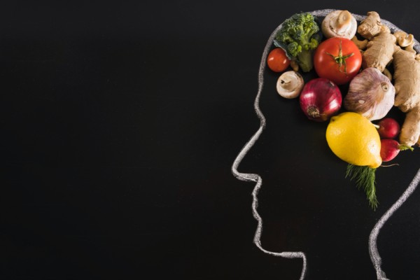 Chalk drawn human head with healthy food for brain on blackboard