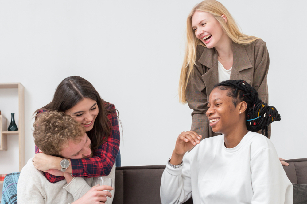 Beautiful young women browsing a laptop together 