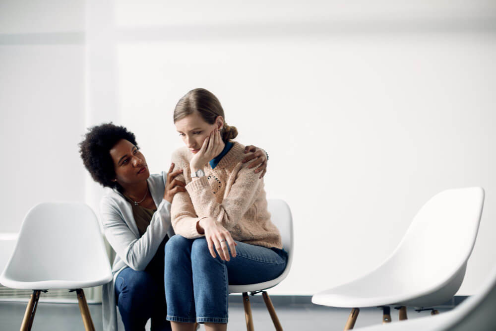 Depressed woman seeking solace from her psychotherapist